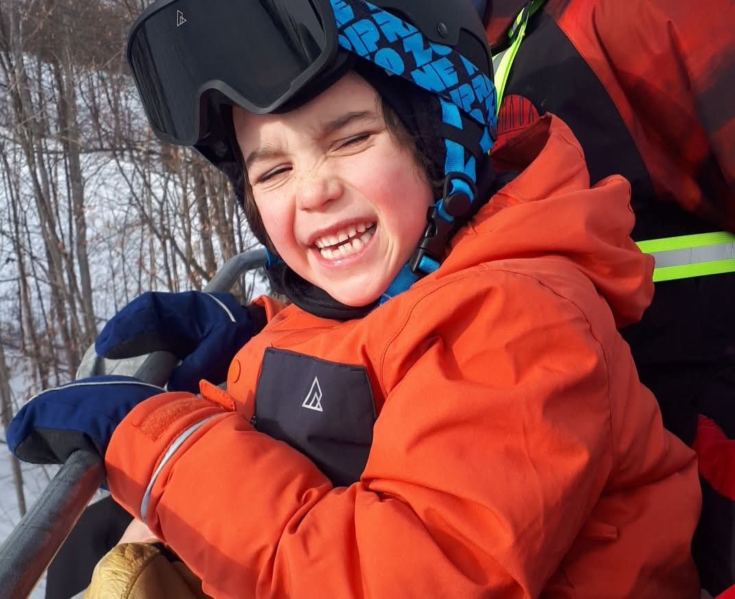 Smiling child in ski gear