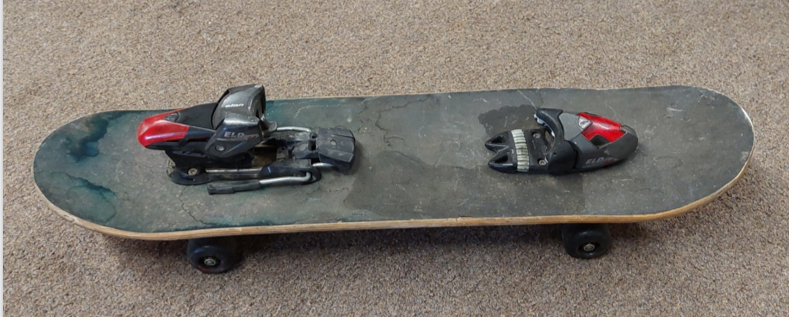 Skateboard with a ski binding